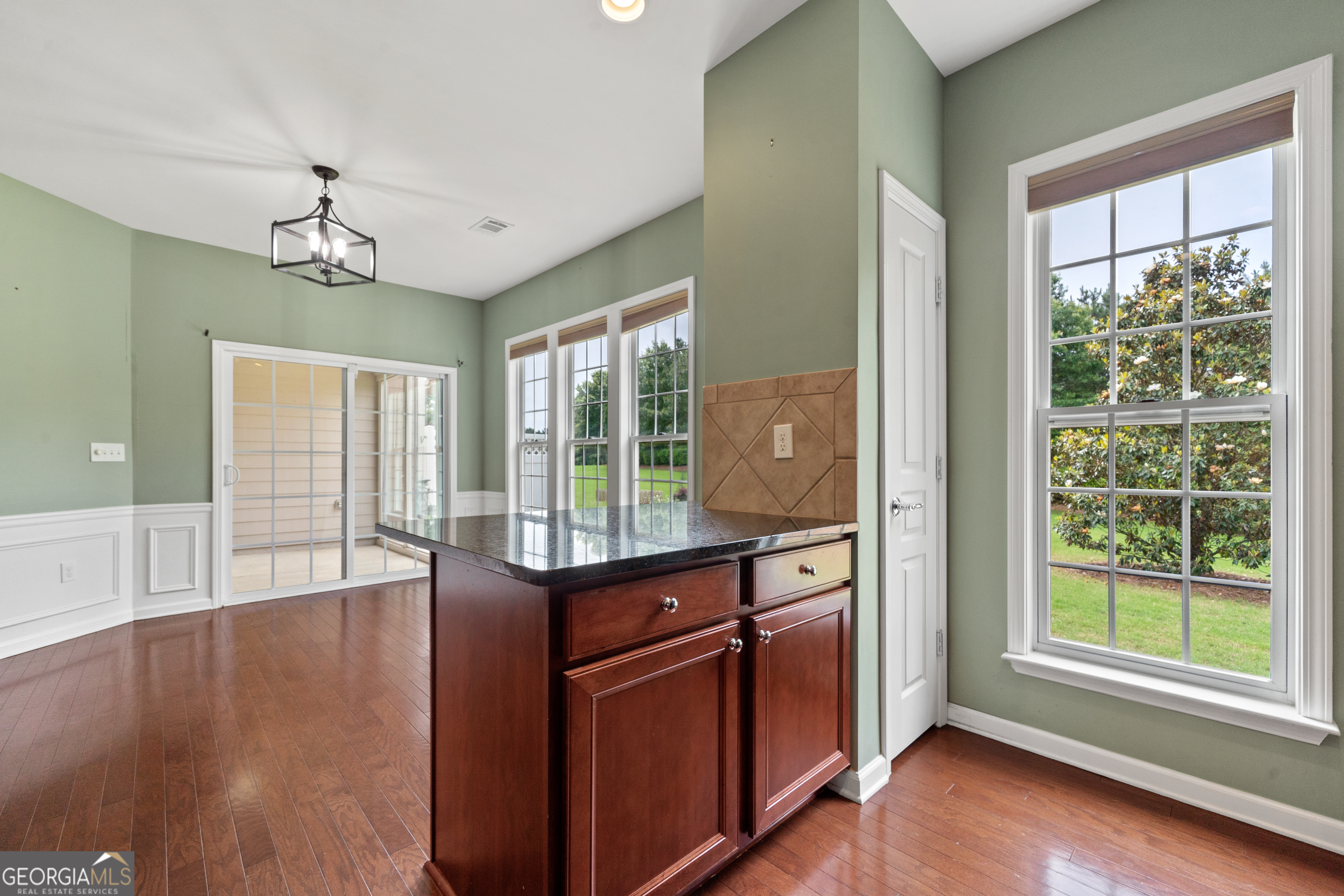 1370 Summer Hollow Road Greensboro, GA 30642 - Photo 16 of 35 a room with wooden floor and balcony