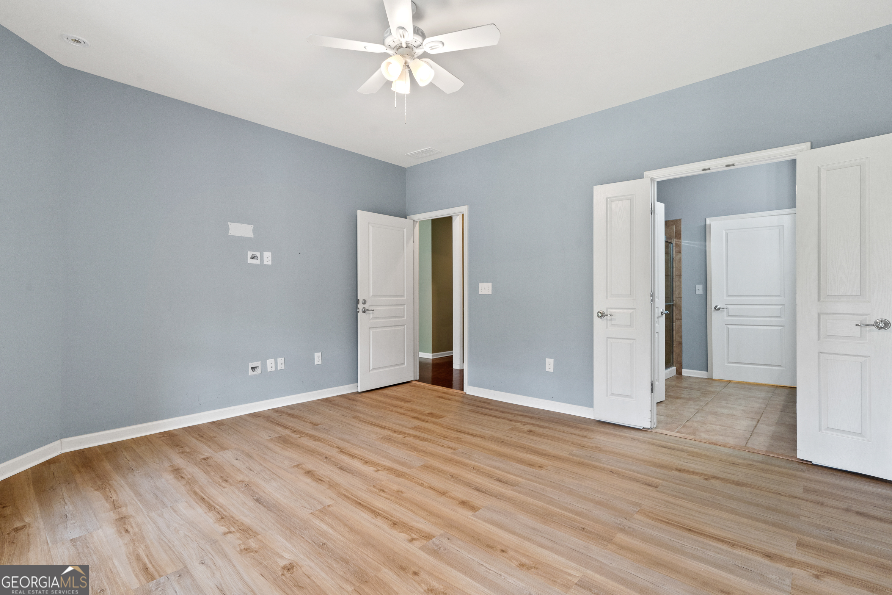 1370 Summer Hollow Road Greensboro, GA 30642 - Photo 21 of 35 a view of an empty room with wooden floor