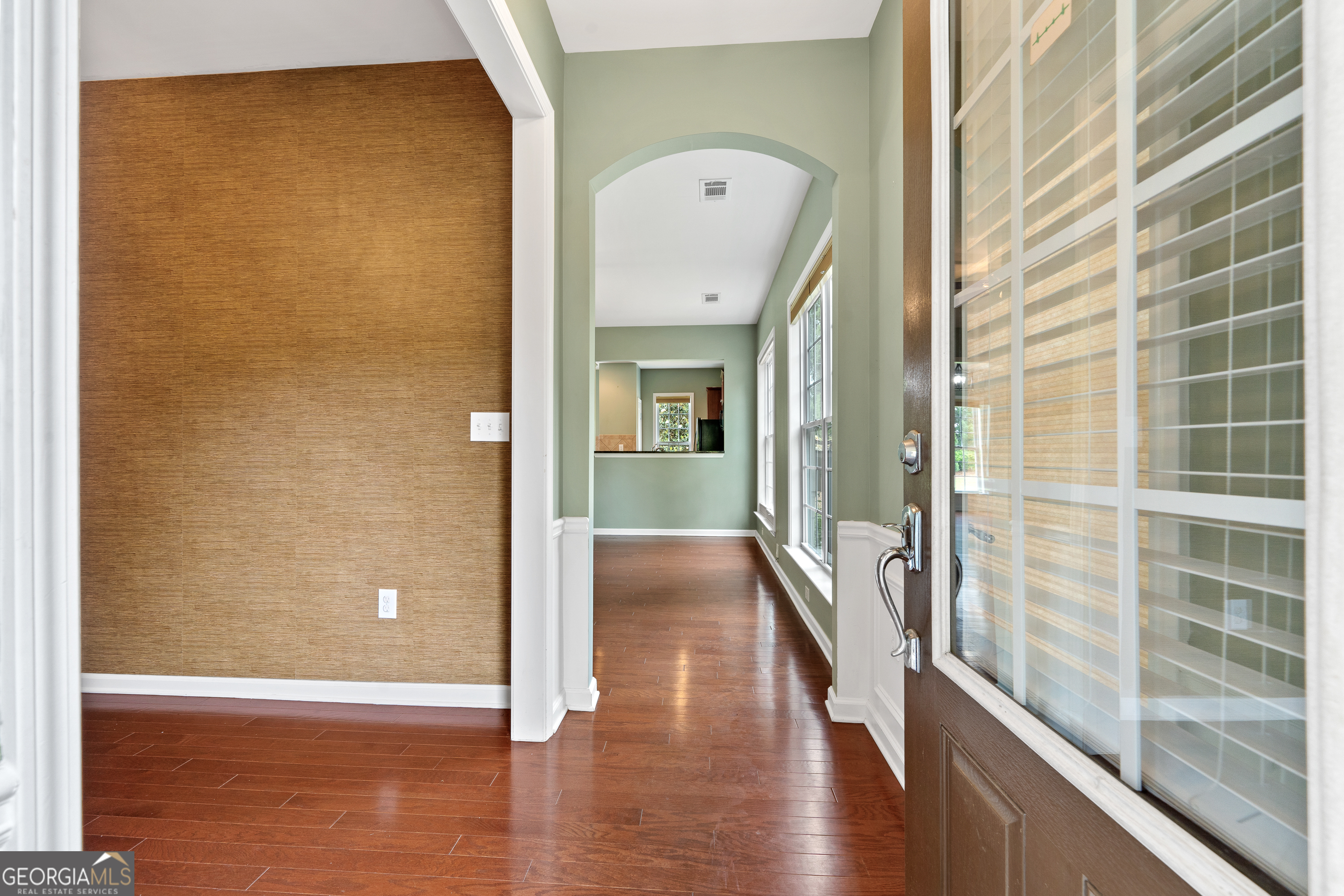 1370 Summer Hollow Road Greensboro, GA 30642 - Photo 4 of 35 a view of a hallway with wooden floor and staircase