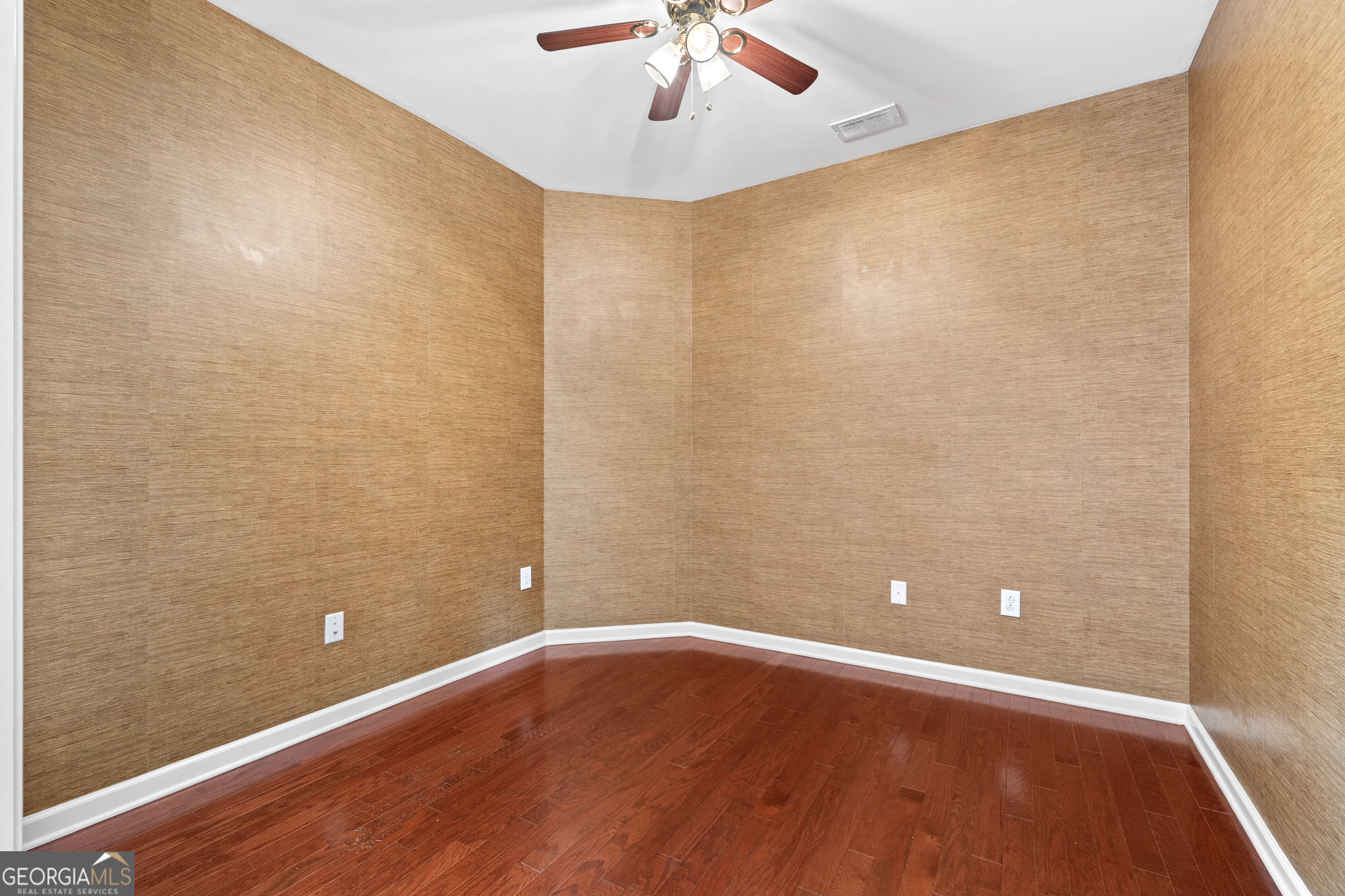 1370 Summer Hollow Road Greensboro, GA 30642 - Photo 5 of 35 a view of room with window and wooden floor
