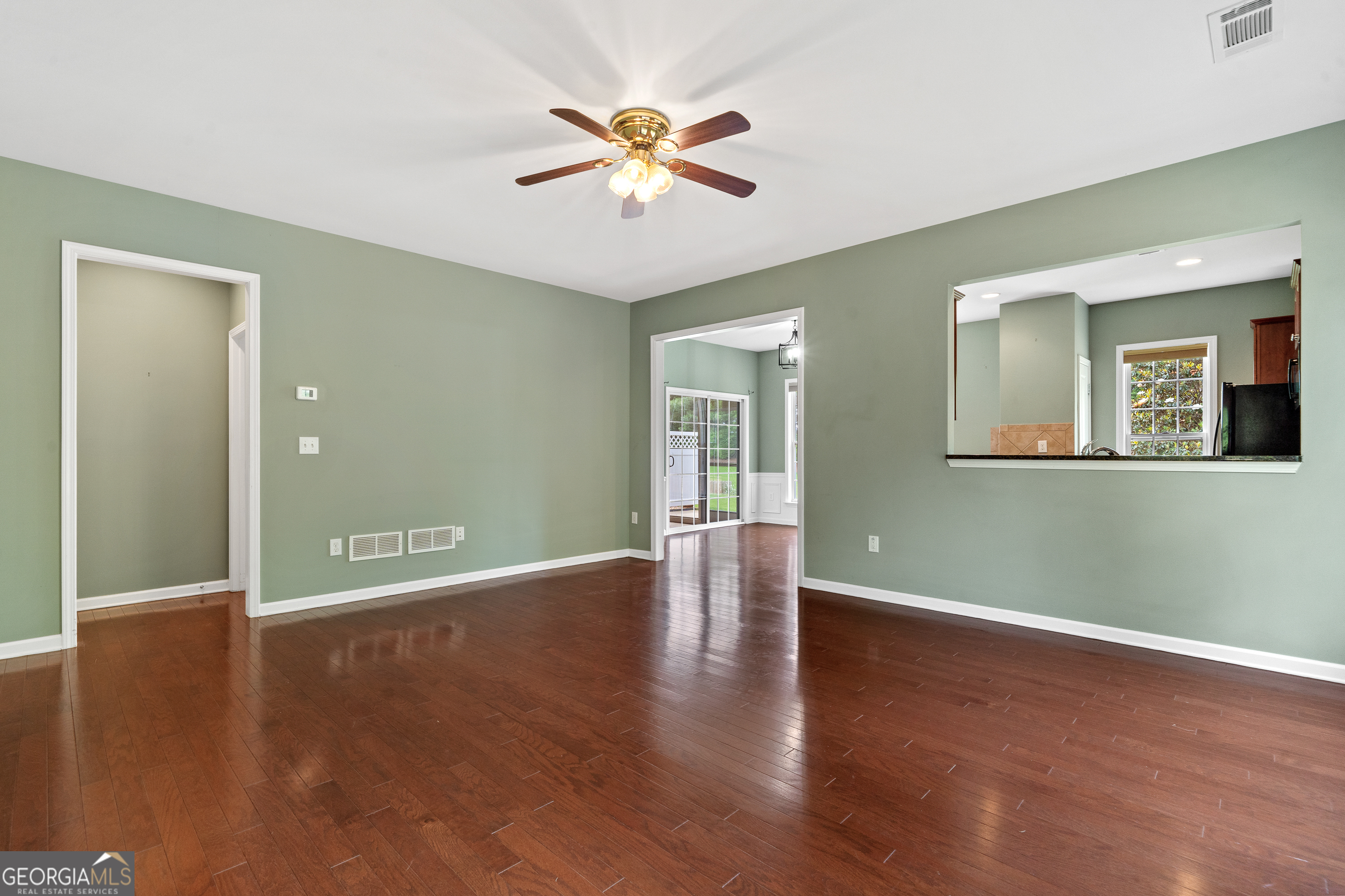 1370 Summer Hollow Road Greensboro, GA 30642 - Photo 8 of 35 a view of an empty room with wooden floor