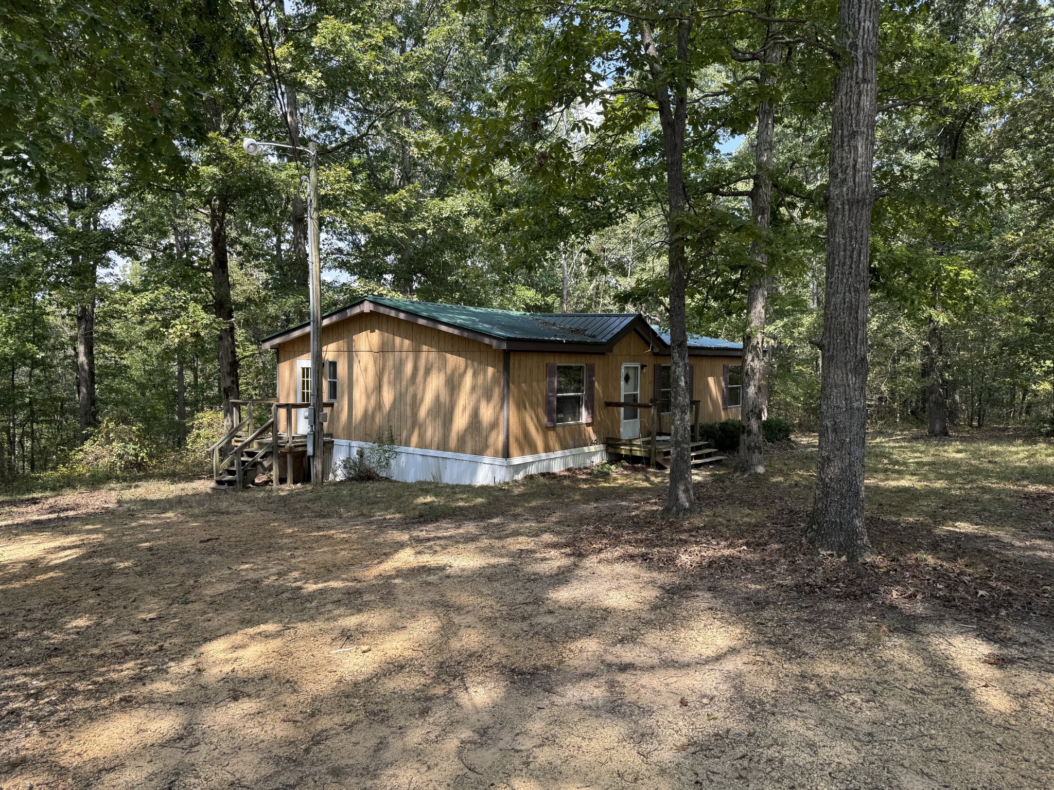 130 Hawk Ridge Road Summertown, TN 38483 - Photo 2 of 14 a house with trees in the background