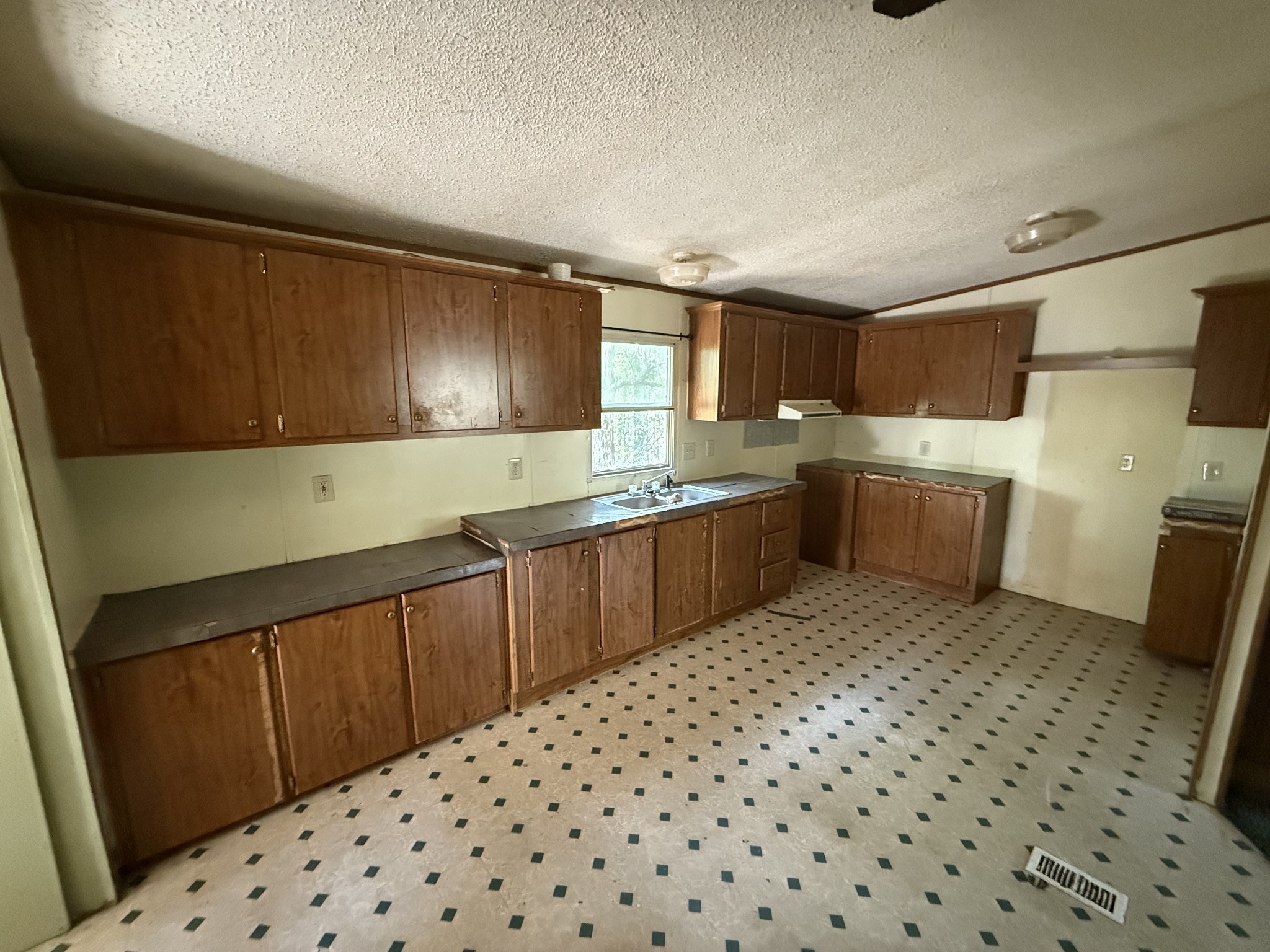130 Hawk Ridge Road Summertown, TN 38483 - Photo 7 of 14 a kitchen with a sink a stove and cabinets