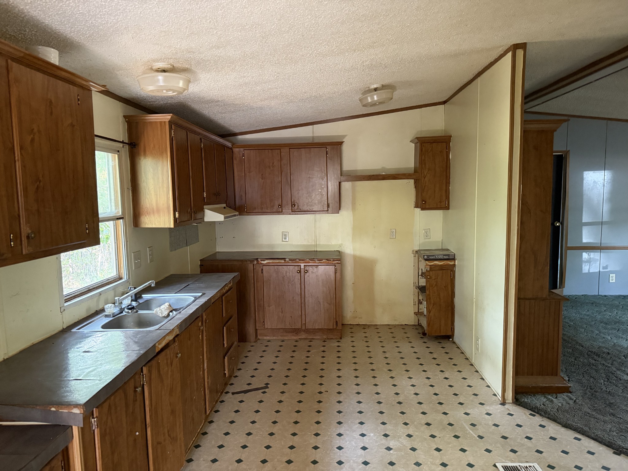 130 Hawk Ridge Road Summertown, TN 38483 - Photo 8 of 14 a kitchen with granite countertop a stove a sink and a refrigerator