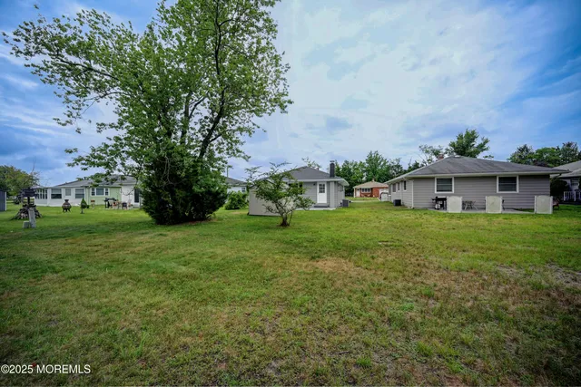 a view of a house with a big yard