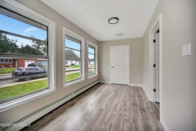 a view of livingroom with hardwood floor and window