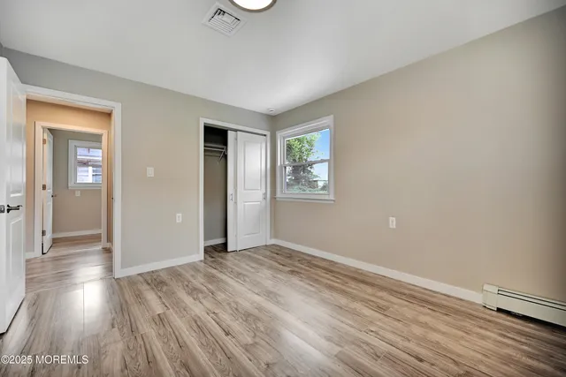 a bathroom with a sink toilet and a mirror