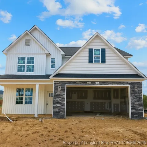 a view of a house with basketball court