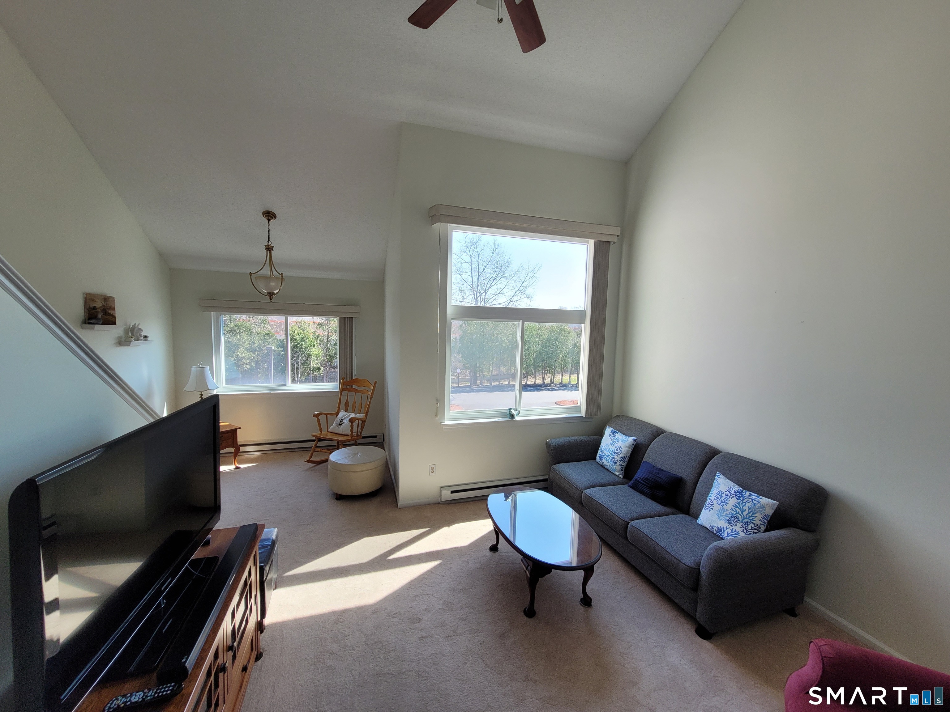 35 Ruth Street, Unit 44 Bristol, CT 06010 - Photo 14 of 35 a living room with furniture and a flat screen tv