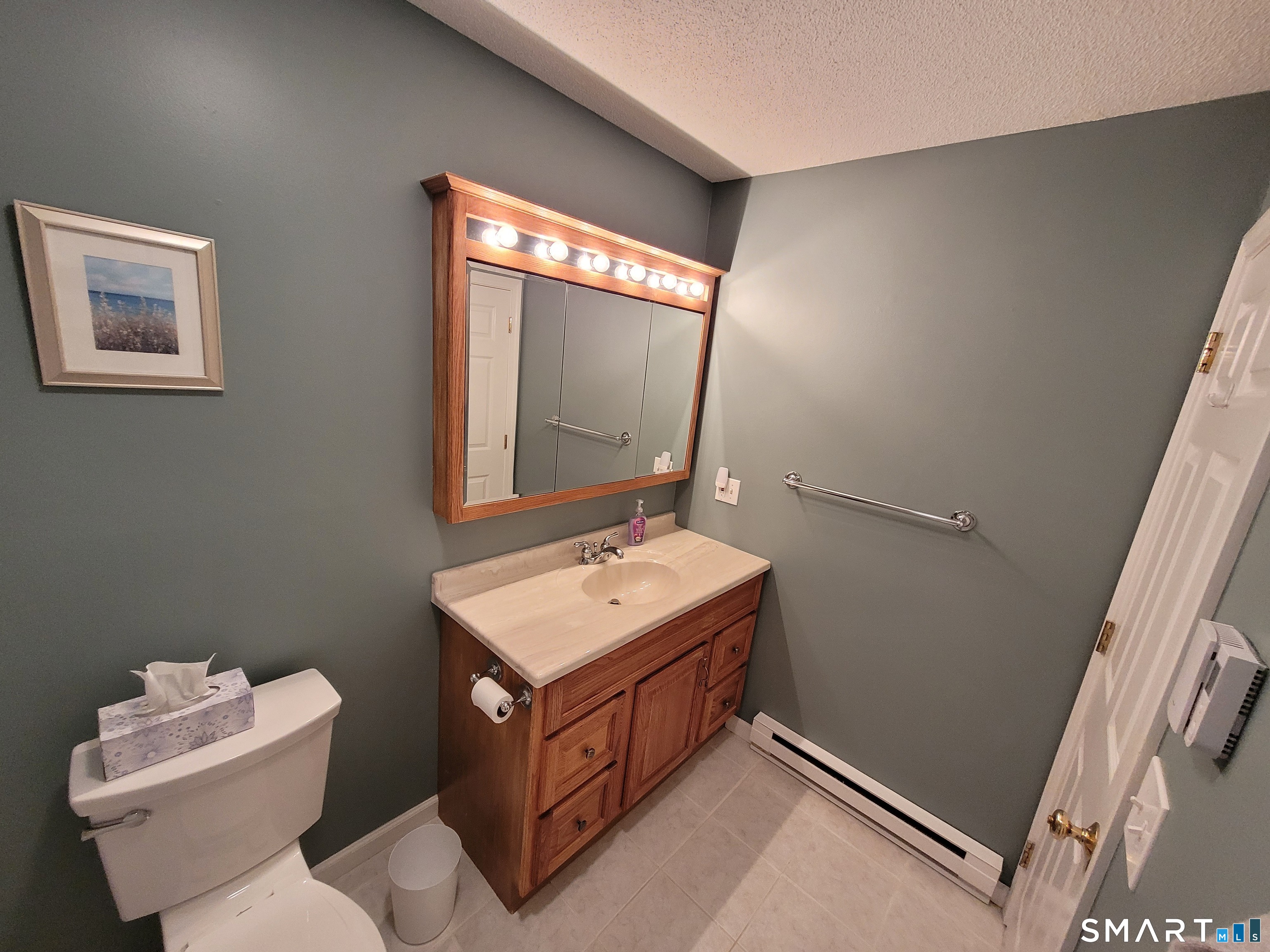 35 Ruth Street, Unit 44 Bristol, CT 06010 - Photo 23 of 35 a bathroom with a toilet sink and mirror
