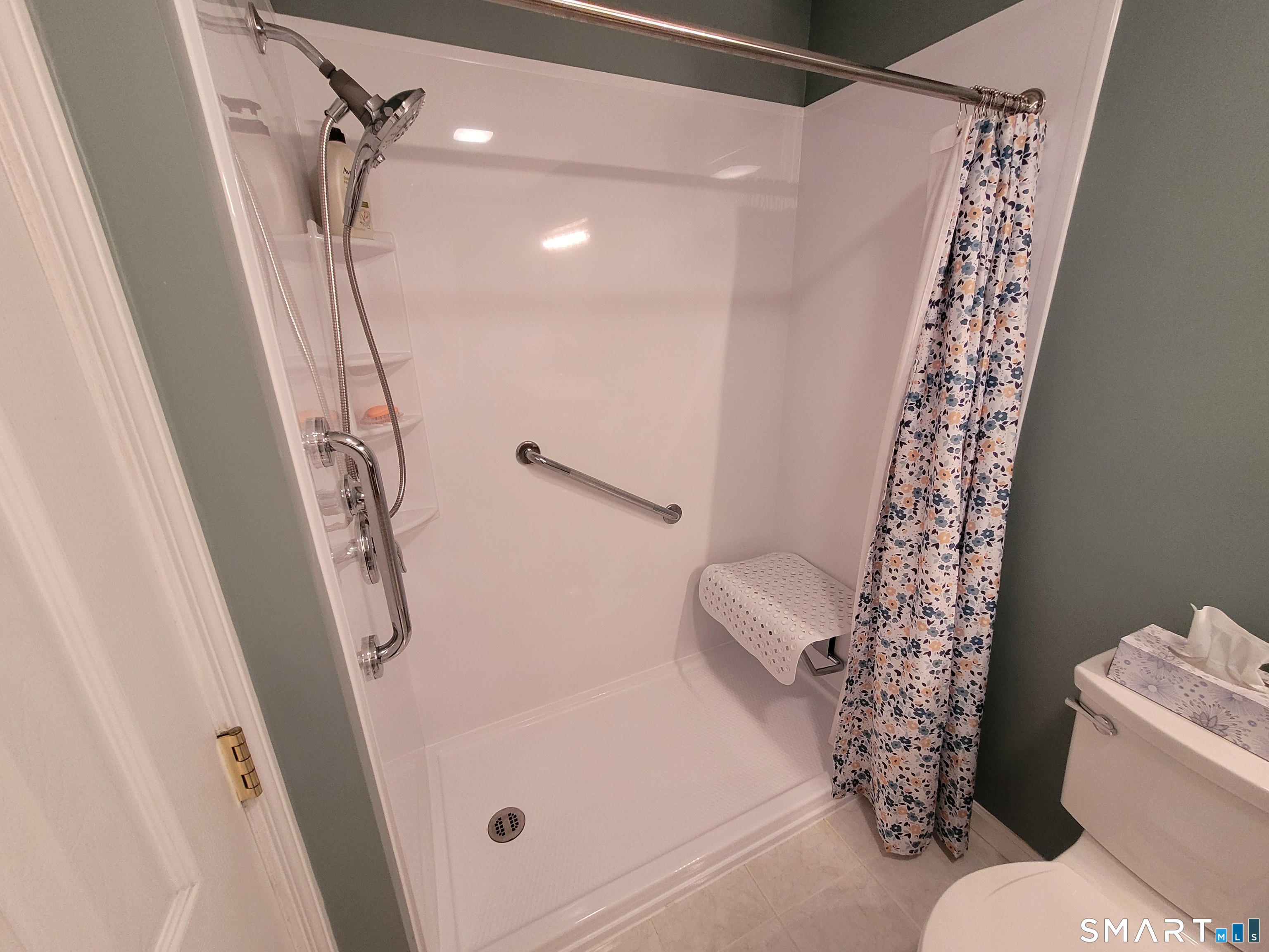 35 Ruth Street, Unit 44 Bristol, CT 06010 - Photo 26 of 35 a bathroom with a shower curtain and a toilet