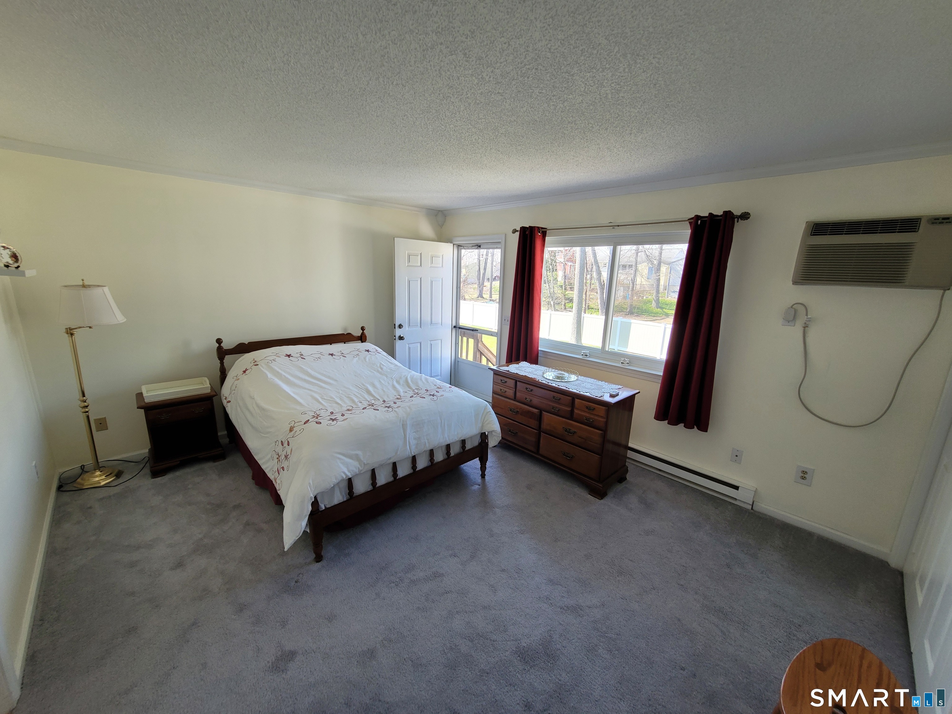 35 Ruth Street, Unit 44 Bristol, CT 06010 - Photo 28 of 35 a bed sitting in a room next to a window