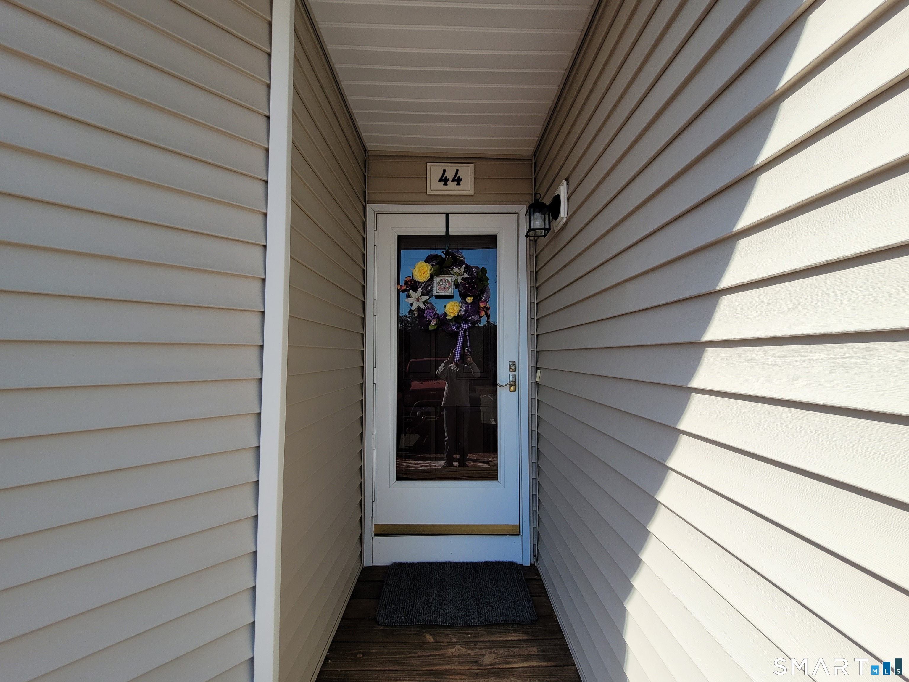 35 Ruth Street, Unit 44 Bristol, CT 06010 - Photo 3 of 35 a view of a door and the balcony