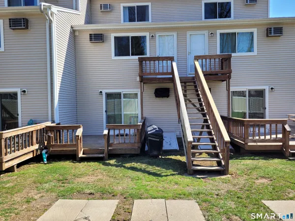 a building exterior with furniture