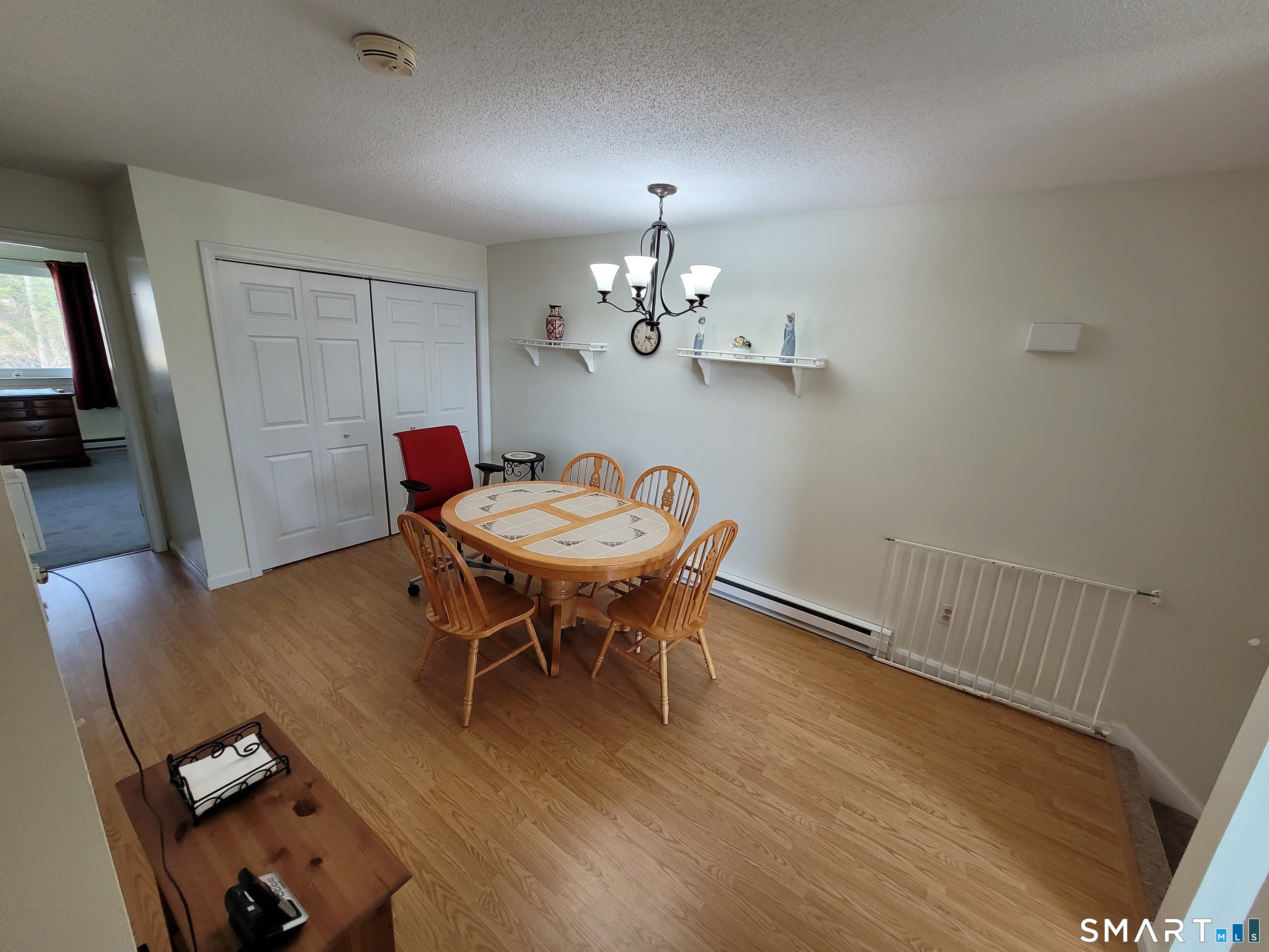 35 Ruth Street, Unit 44 Bristol, CT 06010 - Photo 5 of 35 a view of a dining room with furniture and wooden floor