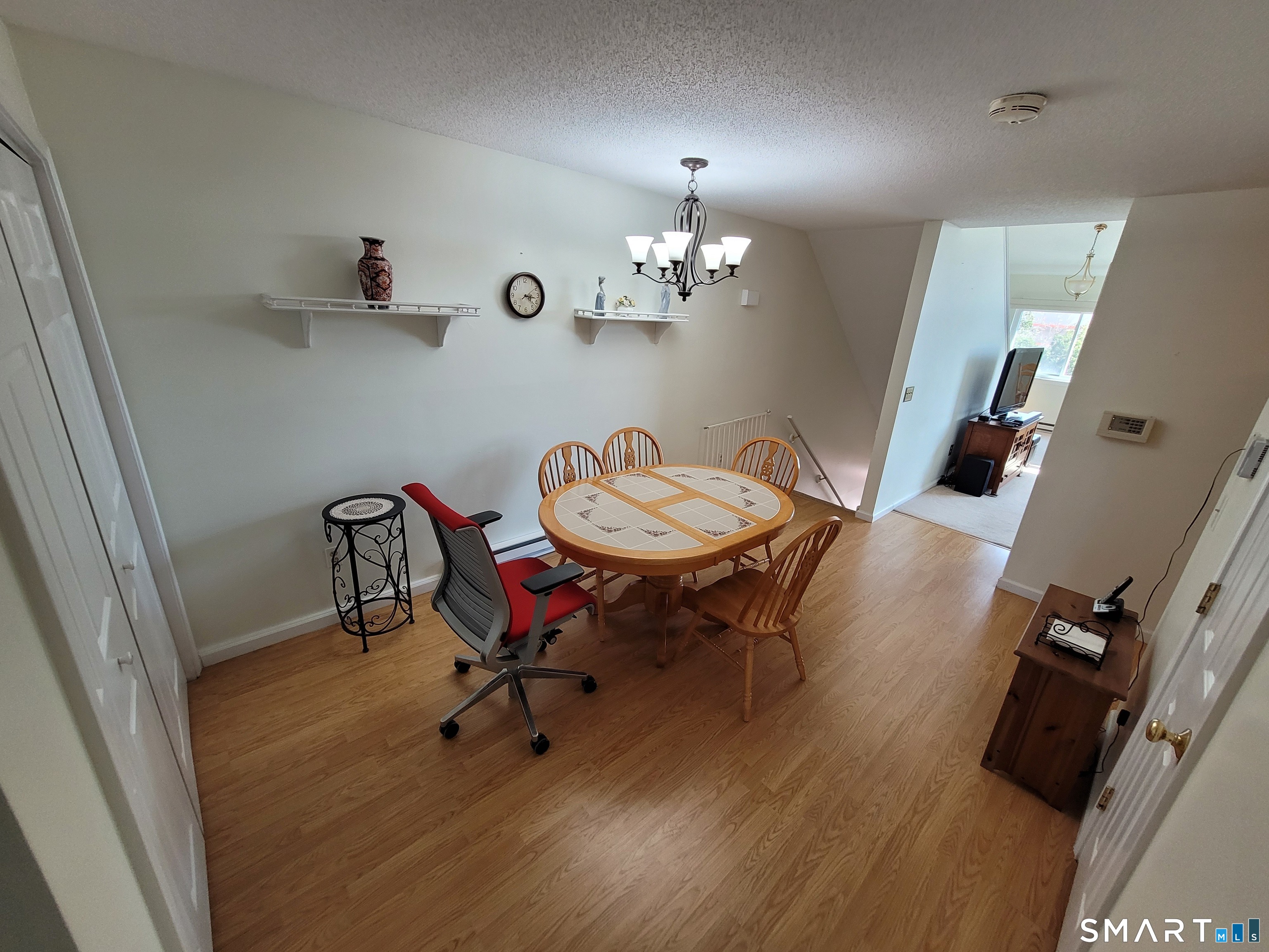 35 Ruth Street, Unit 44 Bristol, CT 06010 - Photo 7 of 35 a view of a dining room with furniture and wooden floor