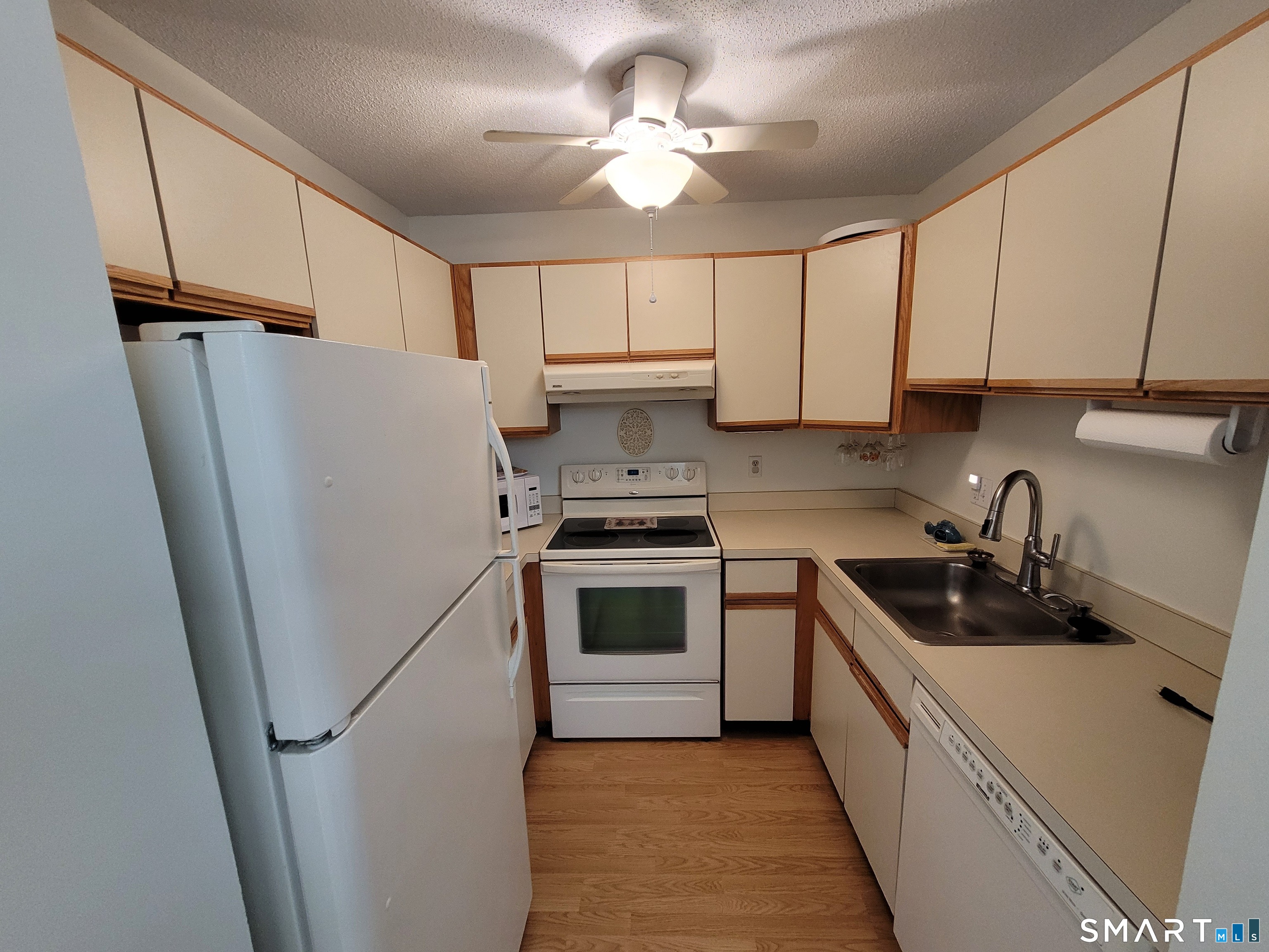 35 Ruth Street, Unit 44 Bristol, CT 06010 - Photo 8 of 35 a kitchen with stainless steel appliances a refrigerator sink and cabinets