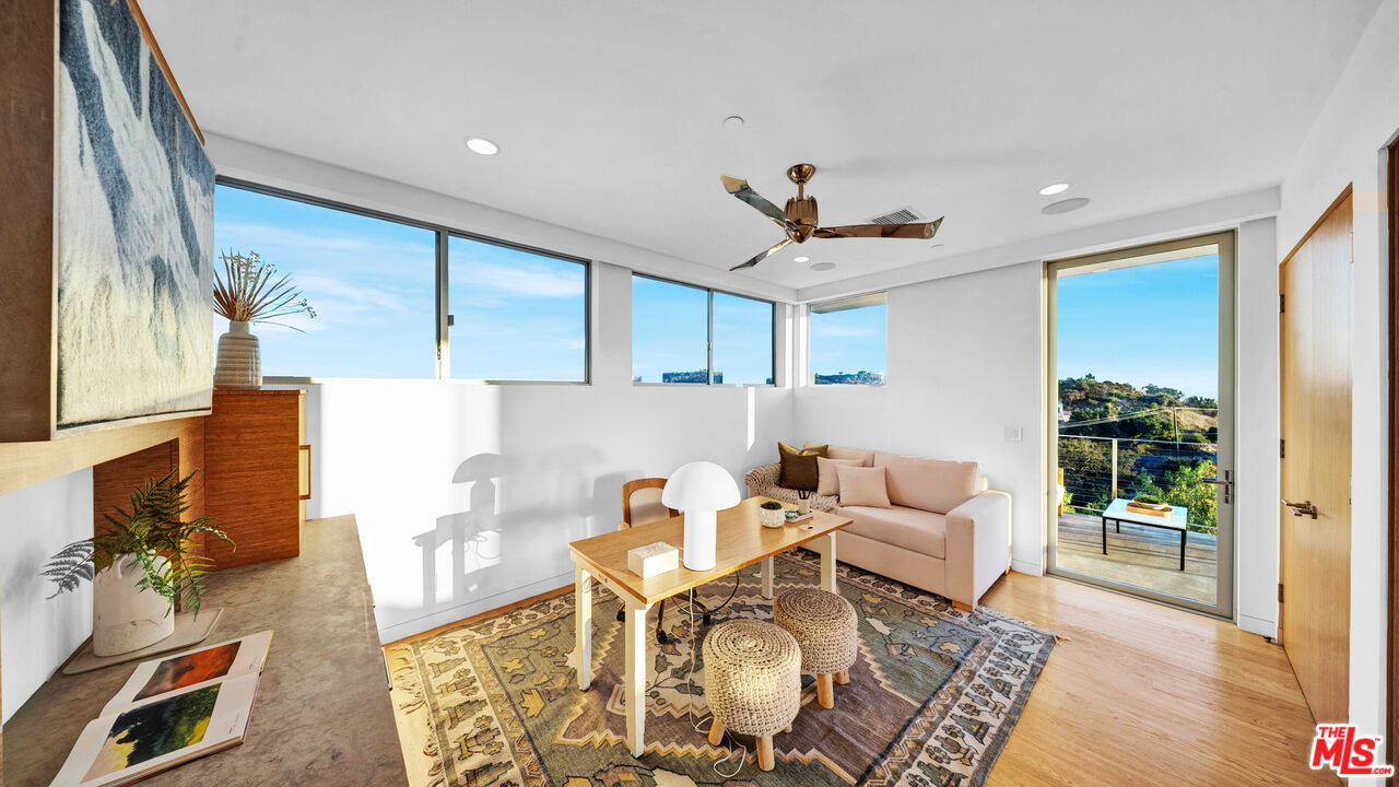 2915 Tuna Canyon Road Topanga, CA 90290 - Photo 28 of 45 a living room with furniture and a large window