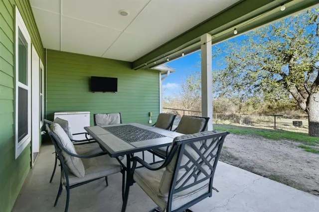 a view of an outdoor sitting area with furniture