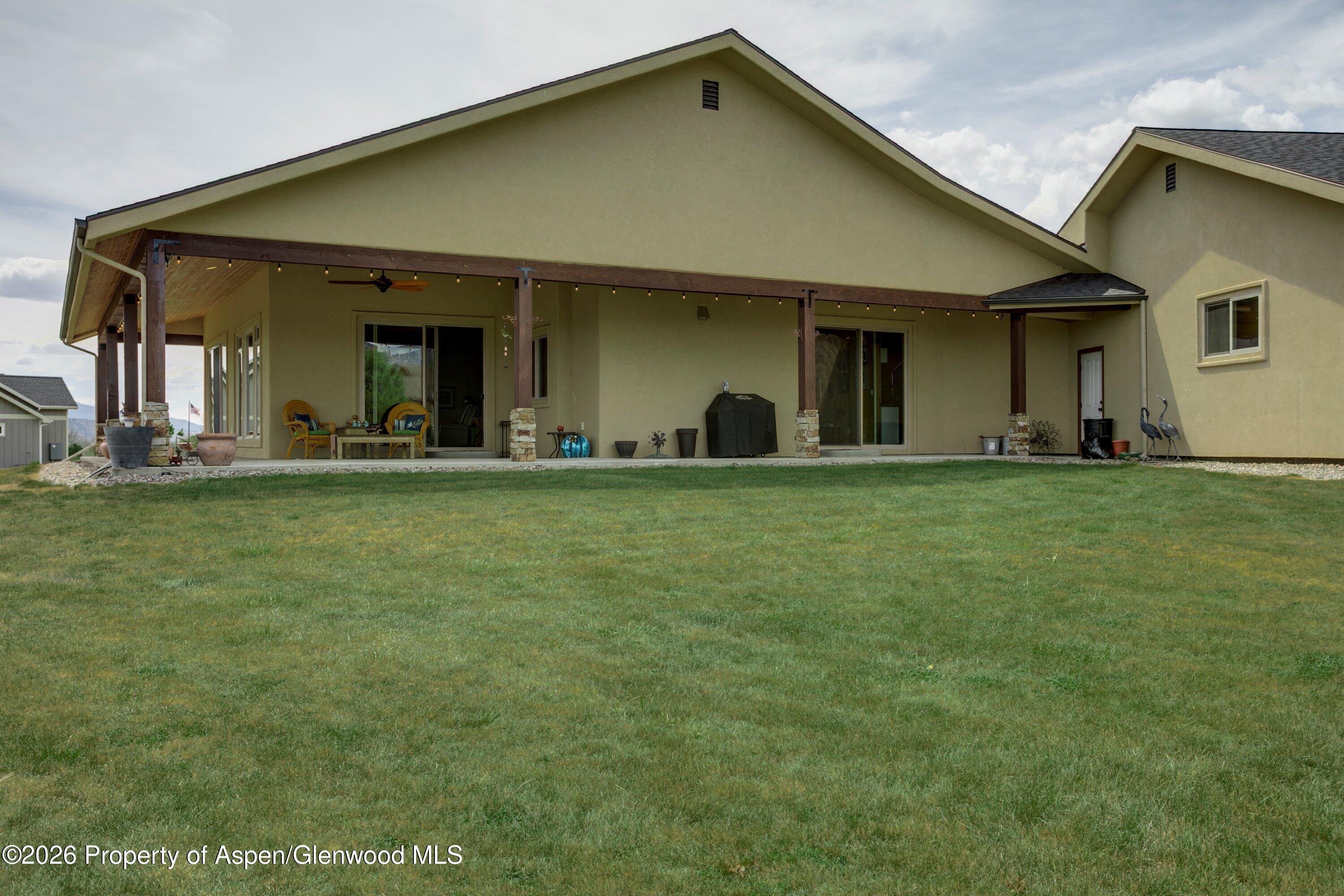265 South Meadow Drive Rifle, CO 81650 - Photo 17 of 76 a view of a house with yard and sitting area