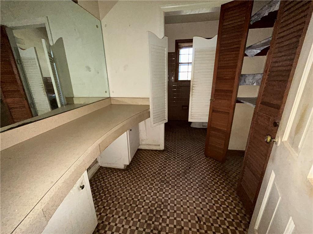 4315 York Road Atlanta, GA 30337 - Photo 16 of 24 a bathroom with a sink a mirror and a shower