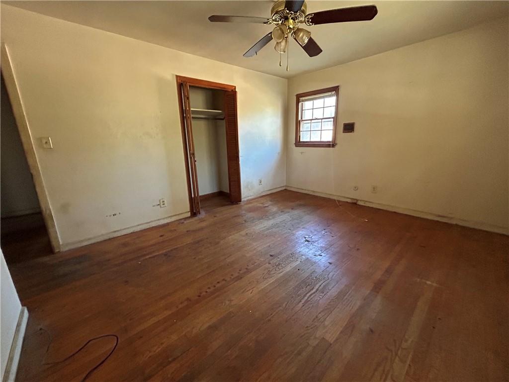 4315 York Road Atlanta, GA 30337 - Photo 20 of 24 an empty room with wooden floor fan and windows