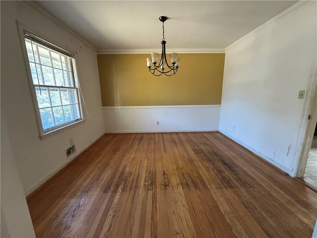 4315 York Road Atlanta, GA 30337 - Photo 7 of 24 an empty room with wooden floor windows and entrance