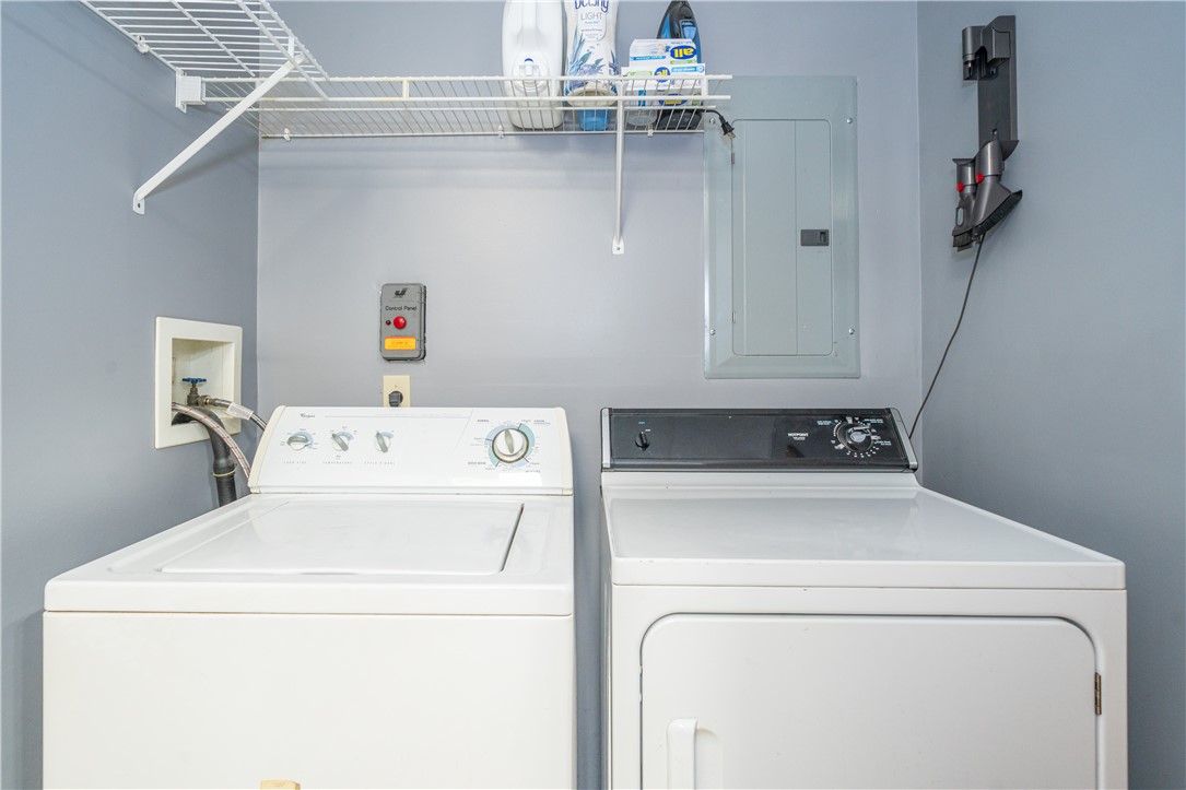 10584 New Biddinger Road Harrison, OH 45030 - Photo 36 of 61 This dedicated laundry area features functional appliances and convenient storage solutions.