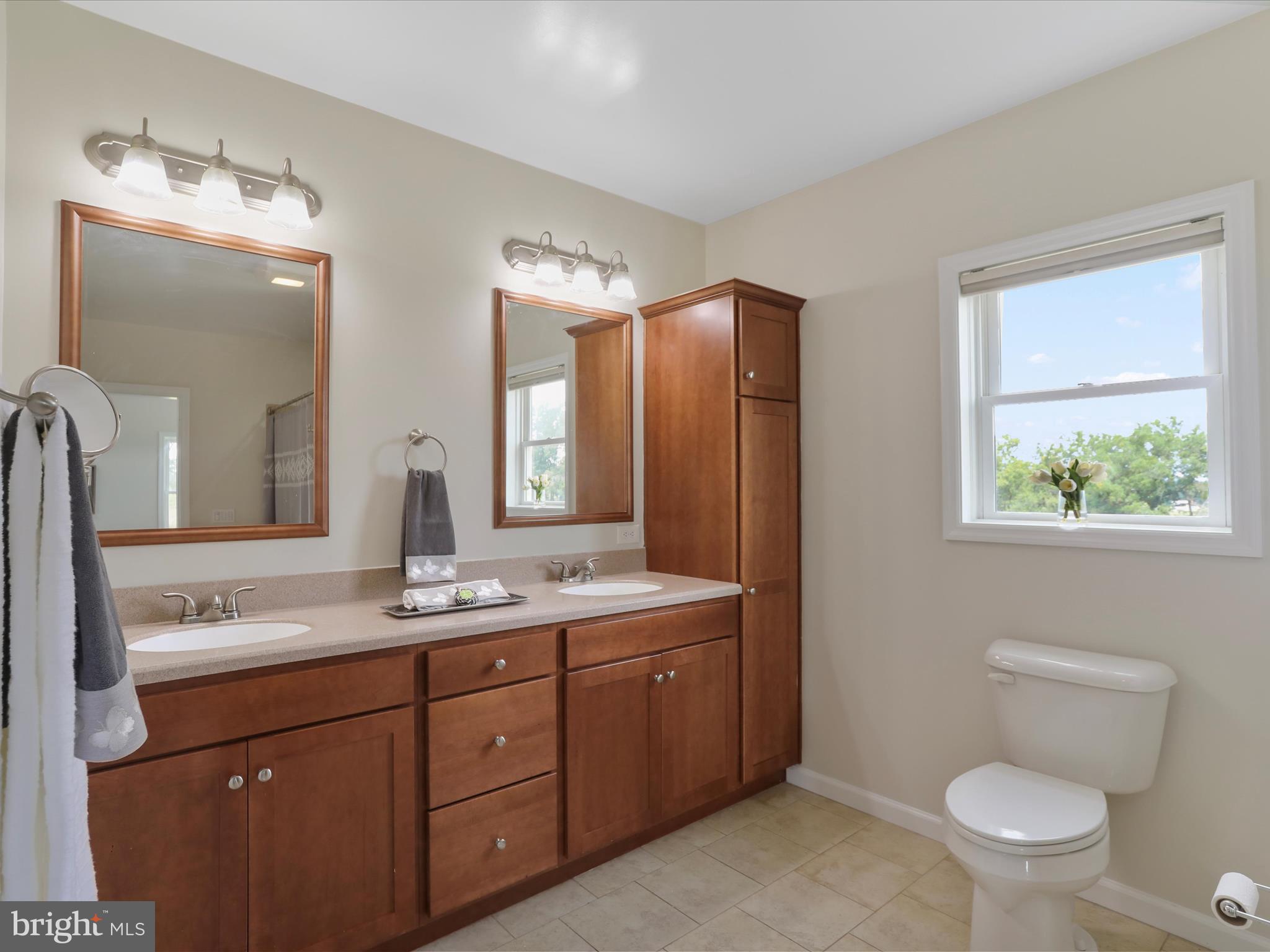 3745 Taneytown Road Gettysburg, PA 17325 - Photo 21 of 87 a bathroom with a granite countertop sink mirror vanity and toilet