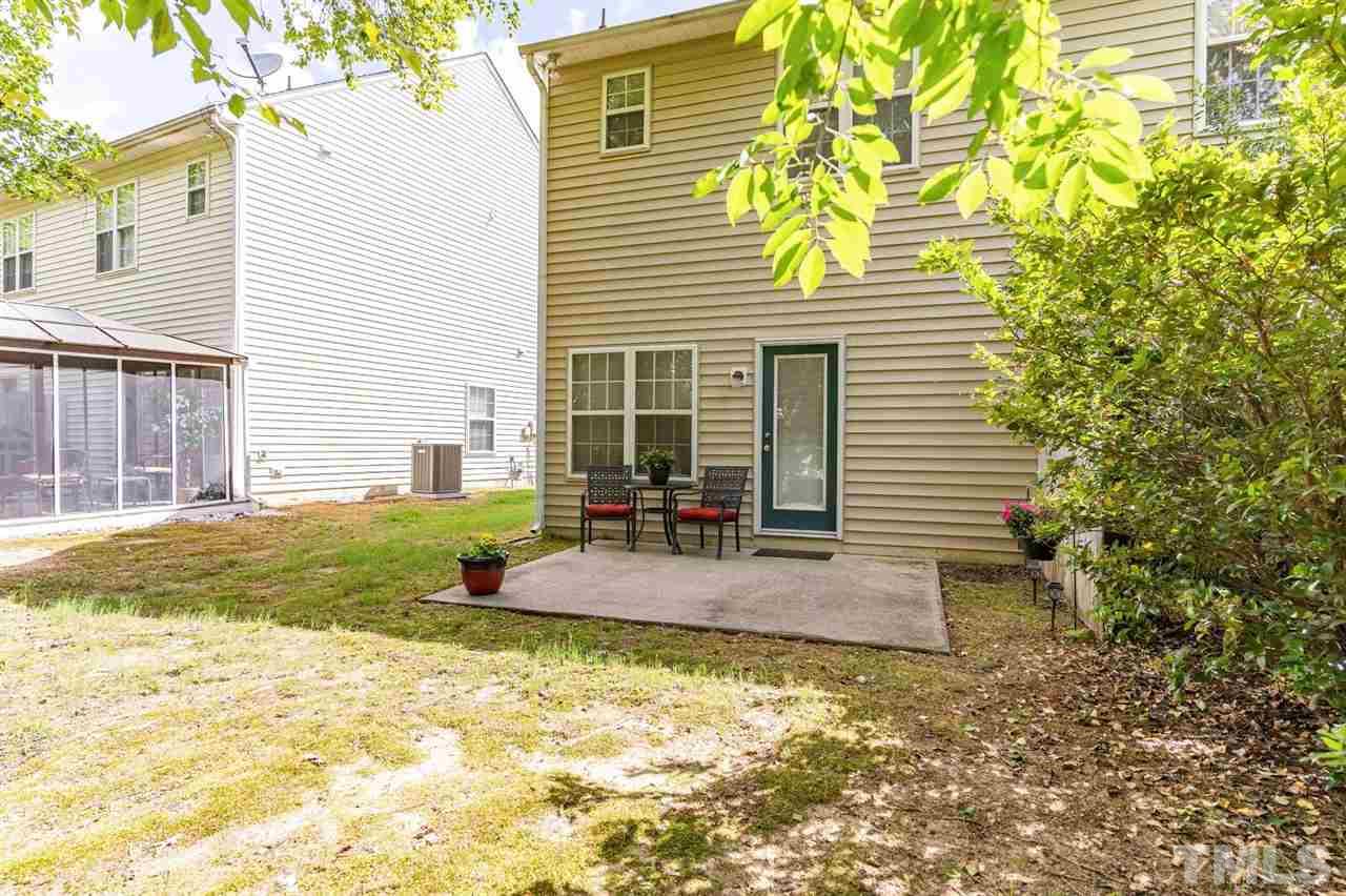 2029 Persimmon Ridge Drive Raleigh, NC 27604 - Photo 22 of 24 a view of a house with a yard and sitting area