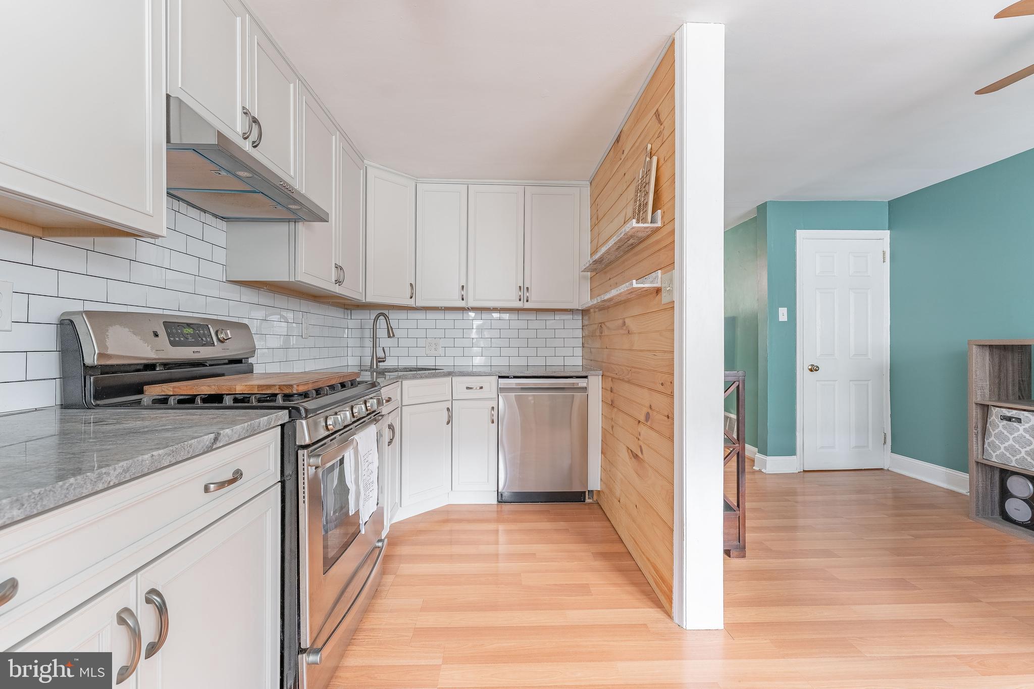 872 Fairfax Road Drexel Hill, PA 19026 - Photo 15 of 31 a kitchen with stainless steel appliances granite countertop a stove a sink and a refrigerator