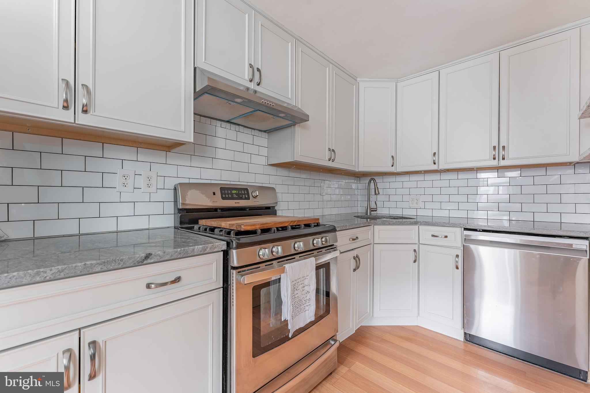 872 Fairfax Road Drexel Hill, PA 19026 - Photo 16 of 31 a kitchen with granite countertop cabinets stainless steel appliances and a sink