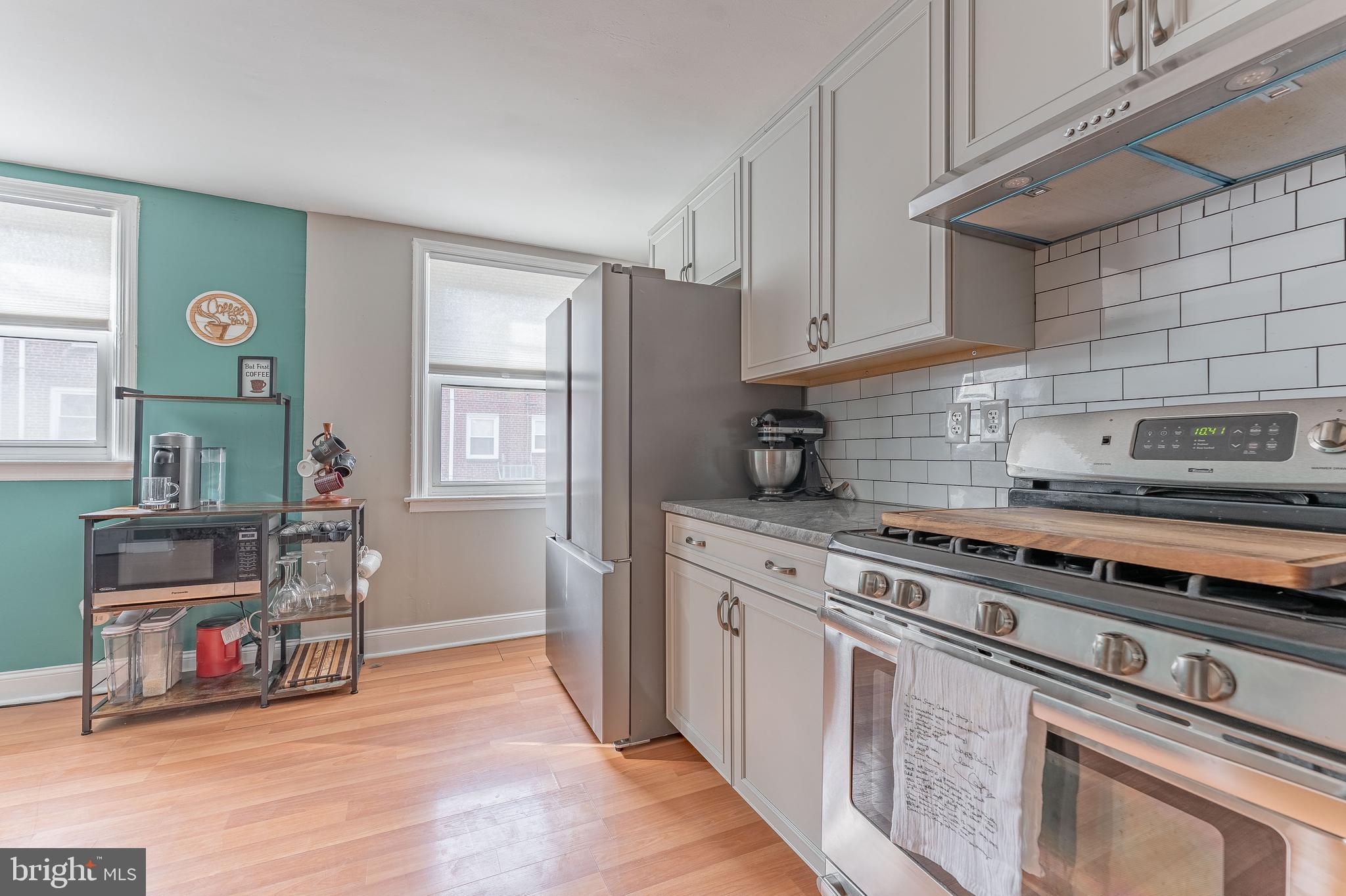 872 Fairfax Road Drexel Hill, PA 19026 - Photo 18 of 31 a kitchen with stainless steel appliances granite countertop a stove and a refrigerator