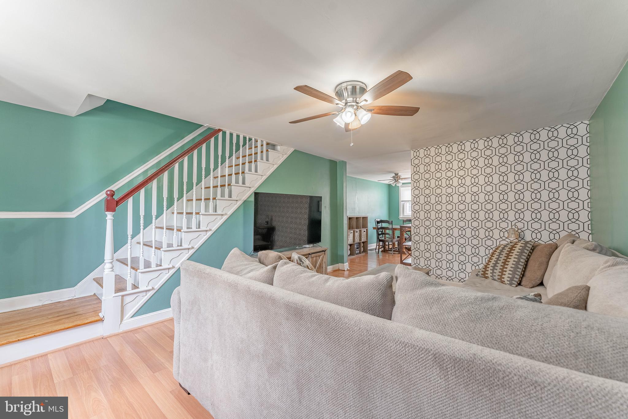 872 Fairfax Road Drexel Hill, PA 19026 - Photo 6 of 31 a living room with furniture and a chandelier