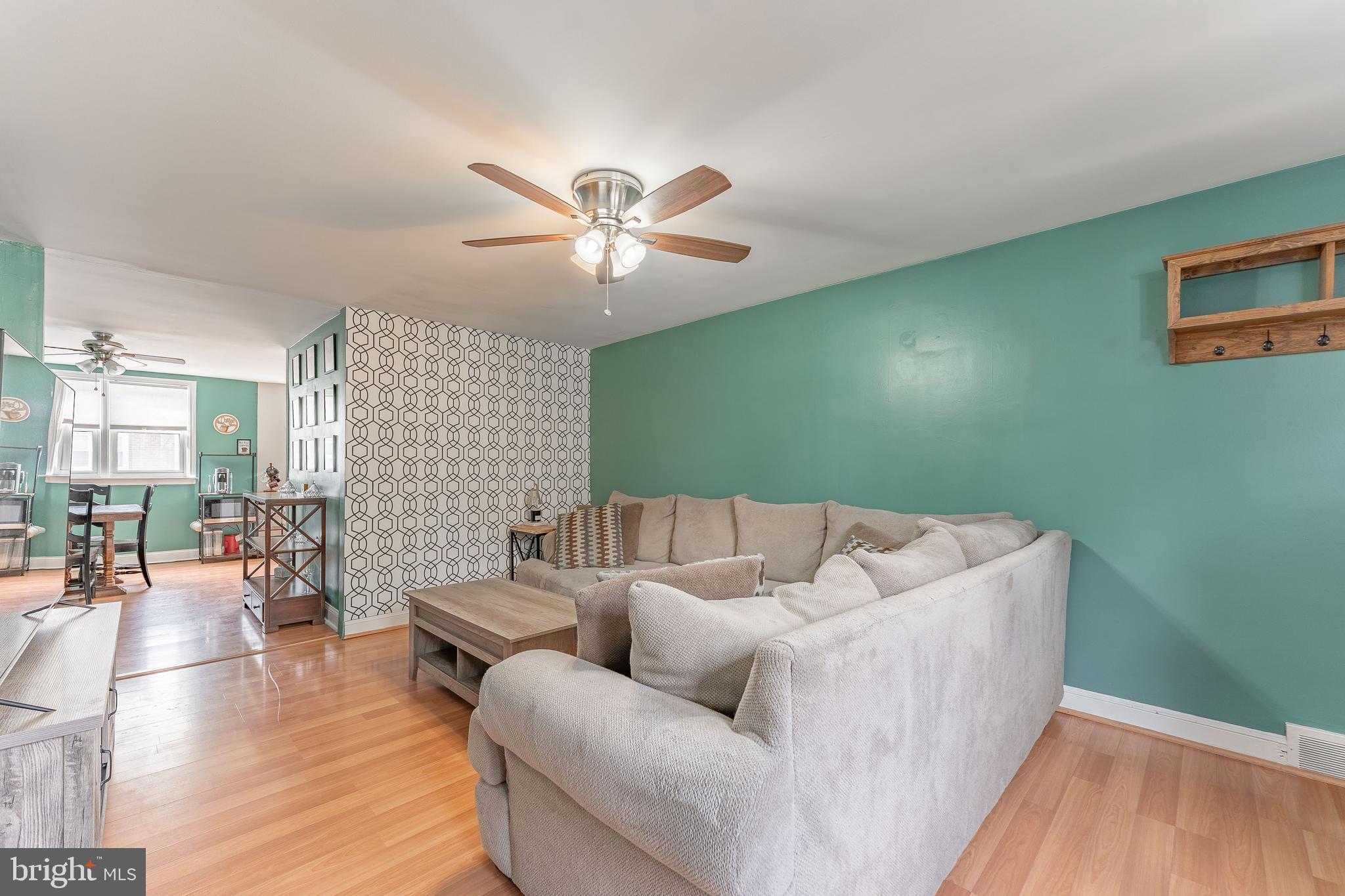 872 Fairfax Road Drexel Hill, PA 19026 - Photo 7 of 31 a living room with furniture and a chandelier