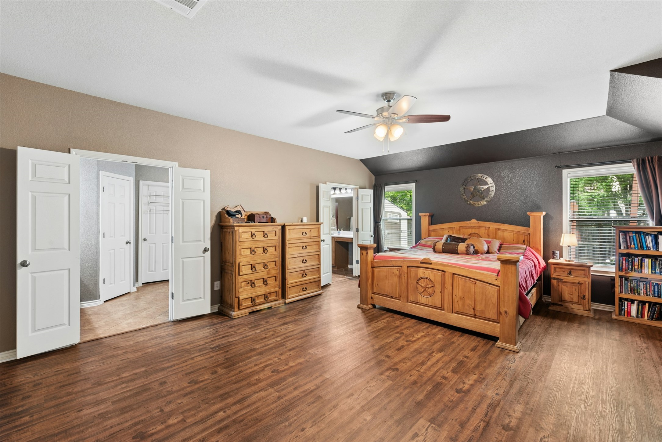 30013 Edgewood Drive Georgetown, TX 78628 - Photo 16 of 39 A private entrance from the Family Room leads you to the Primary Bedroom with lovely vinyl plank flooring. Plenty of space for for your furniture and even a sitting area.