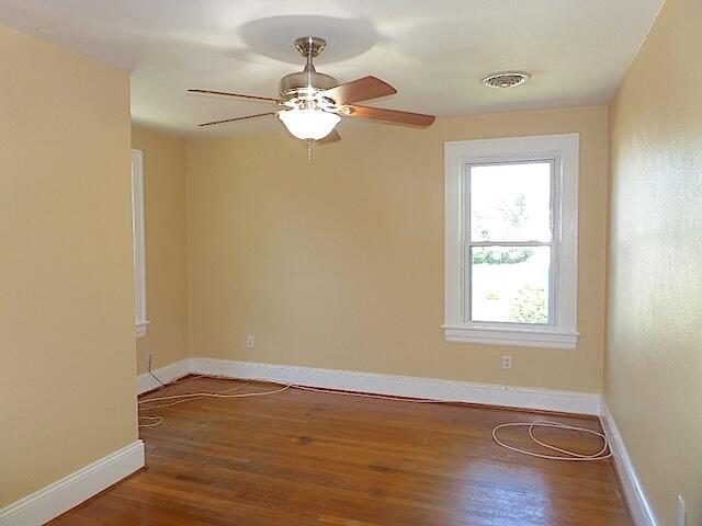 417 Fieldale Road Northeast Roanoke, VA 24012 - Photo 19 of 34 a view of an empty room with wooden floor and a window