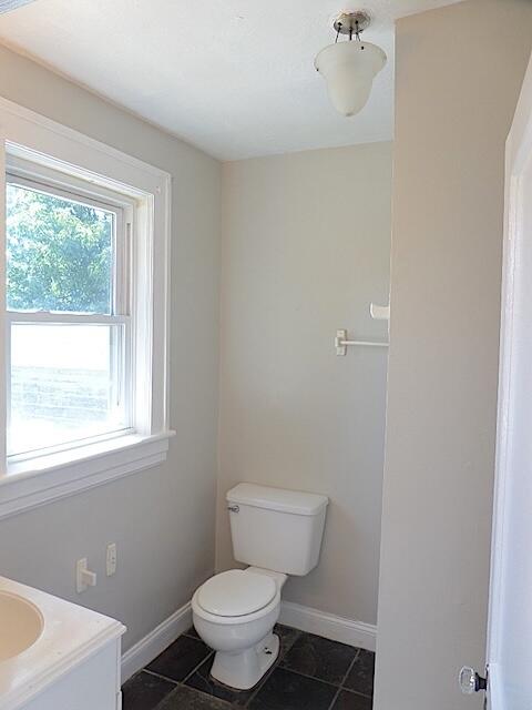417 Fieldale Road Northeast Roanoke, VA 24012 - Photo 19 of 37 a bathroom with a toilet sink and window