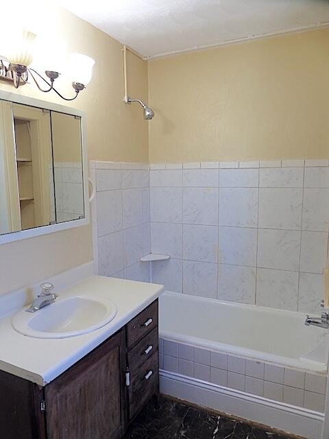 417 Fieldale Road Northeast Roanoke, VA 24012 - Photo 31 of 37 a bathroom with a sink and a mirror