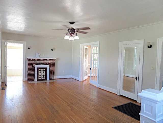 417 Fieldale Road Northeast Roanoke, VA 24012 - Photo 4 of 34 a view of an empty room with wooden floor and a fireplace