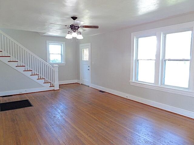 417 Fieldale Road Northeast Roanoke, VA 24012 - Photo 5 of 34 a view of an empty room with wooden floor and a window