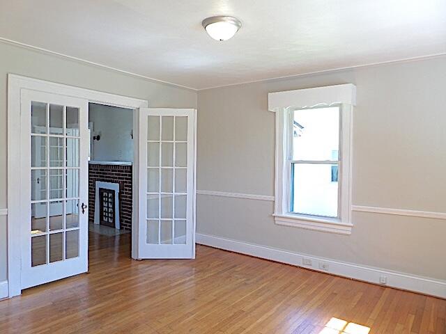 417 Fieldale Road Northeast Roanoke, VA 24012 - Photo 9 of 37 an empty room with wooden floor and windows