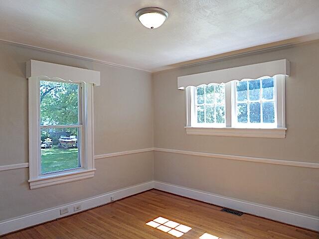 417 Fieldale Road Northeast Roanoke, VA 24012 - Photo 10 of 37 an empty room with wooden floor and windows