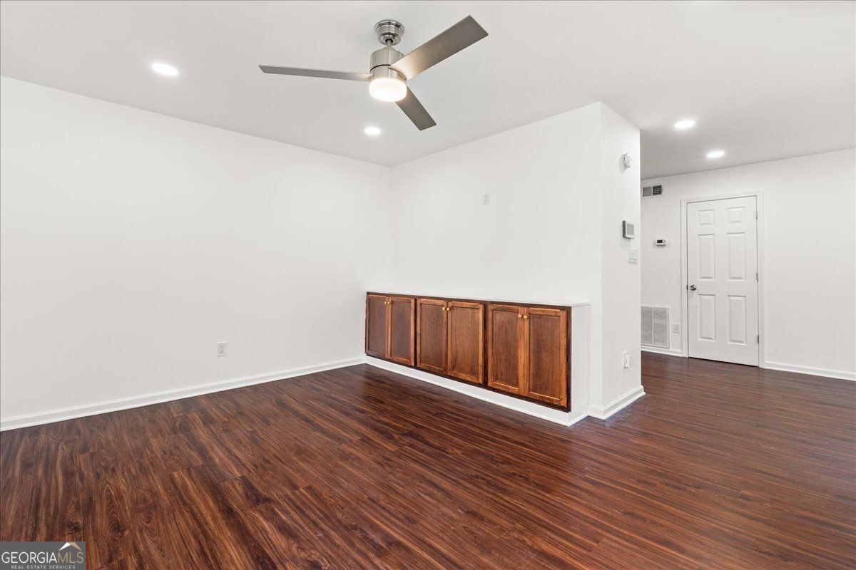 3755 Mulkey Road Marietta, GA 30008 - Photo 2 of 17 a view of an empty room with wooden floor