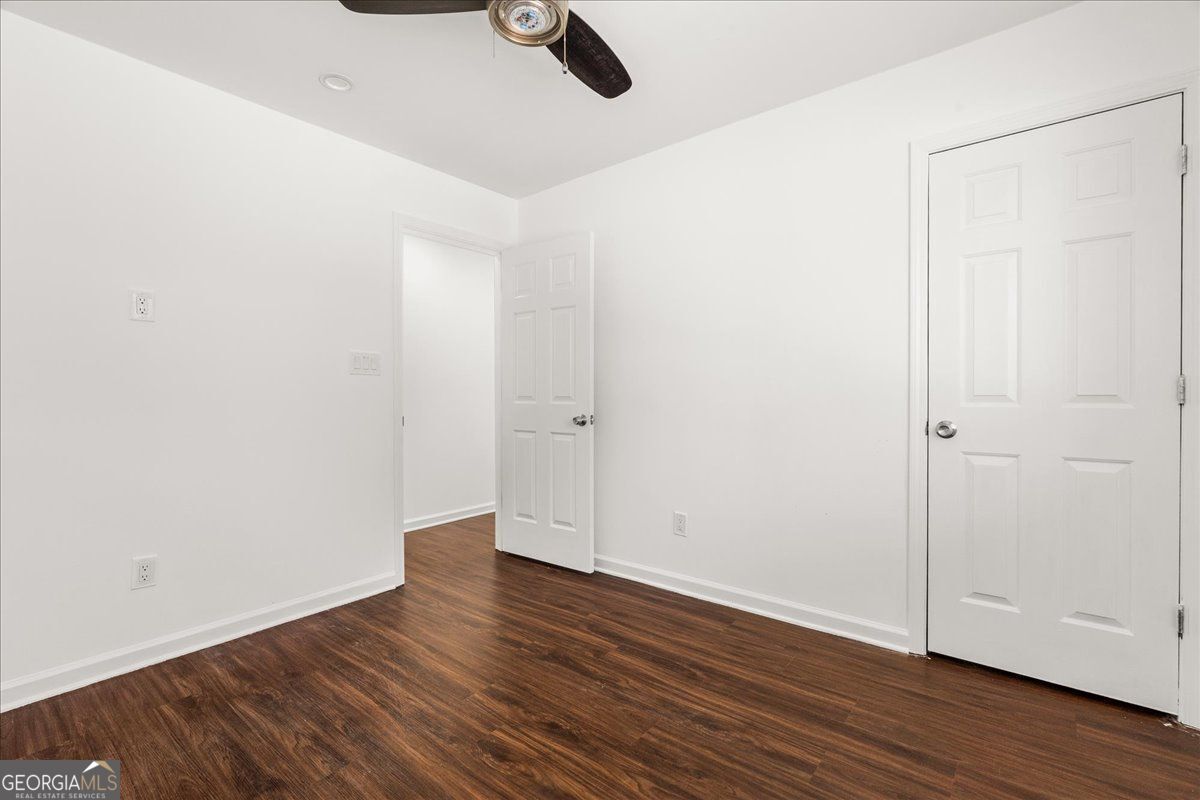 3755 Mulkey Road Marietta, GA 30008 - Photo 6 of 17 an empty room with wooden floor