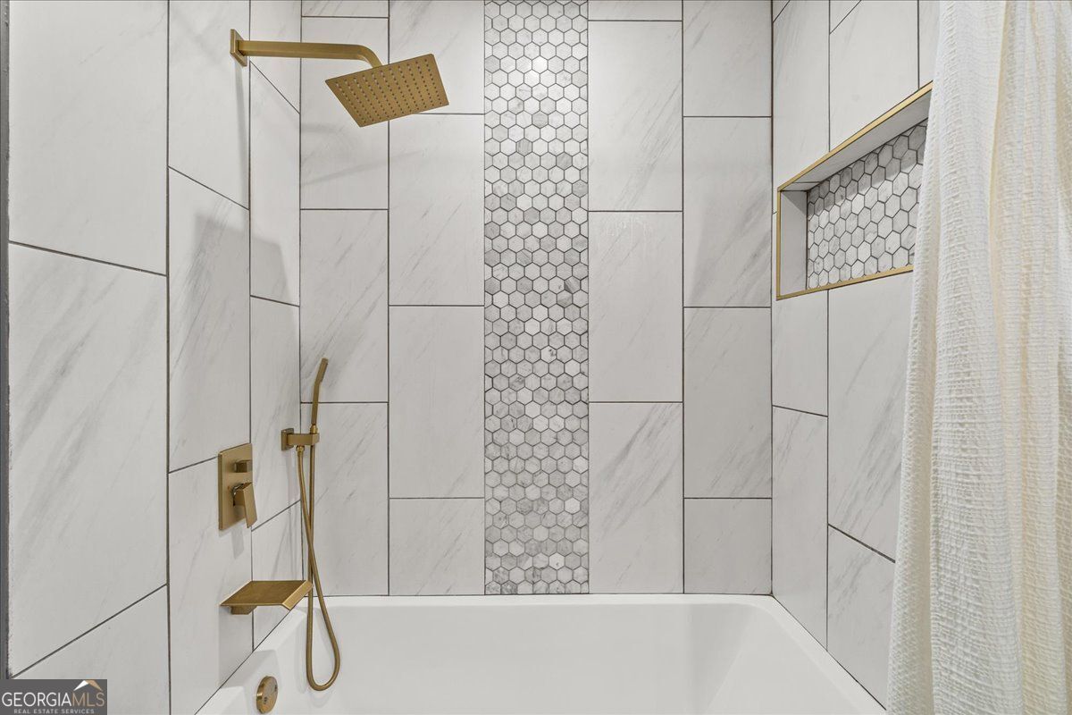 3755 Mulkey Road Marietta, GA 30008 - Photo 10 of 17 a bathroom with a bathtub and shower