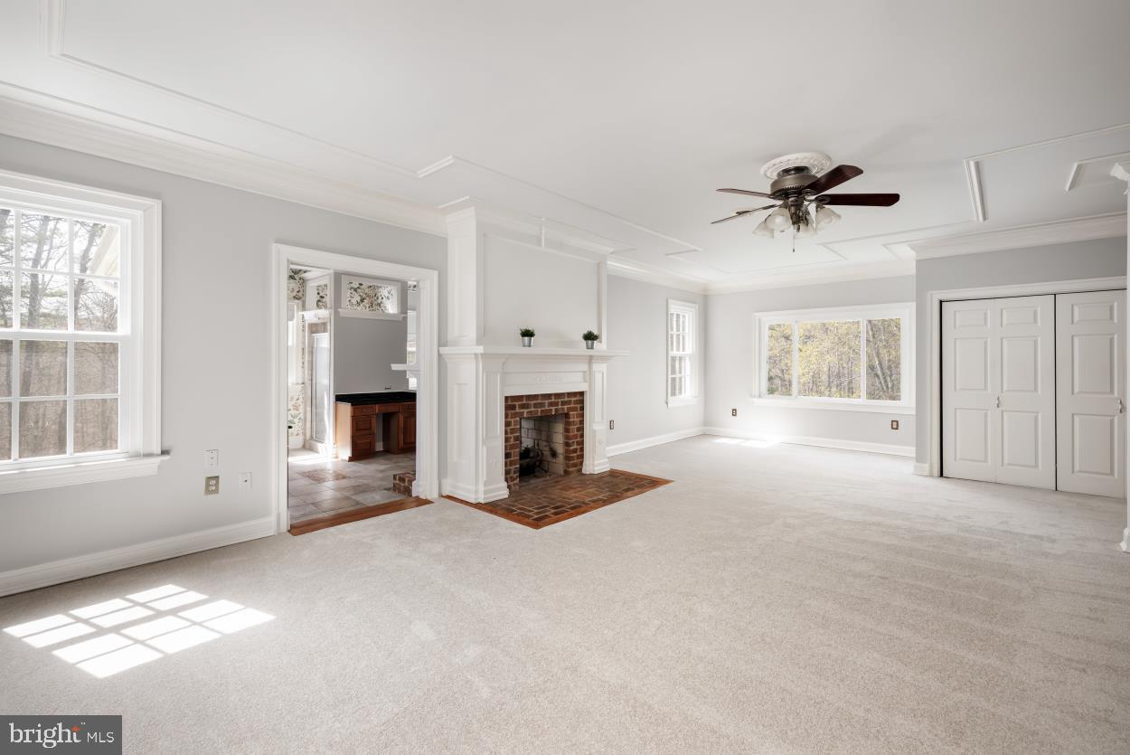 5930 Wilson Road Marshall, VA 20115 - Photo 28 of 46 a view of an empty room with a fireplace and a window