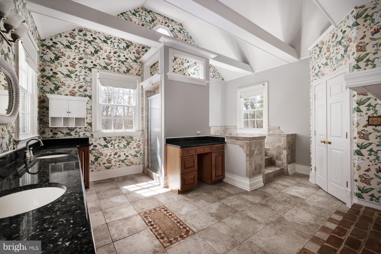 5930 Wilson Road Marshall, VA 20115 - Photo 29 of 46 a spacious bathroom with a granite countertop sink a toilet and shower