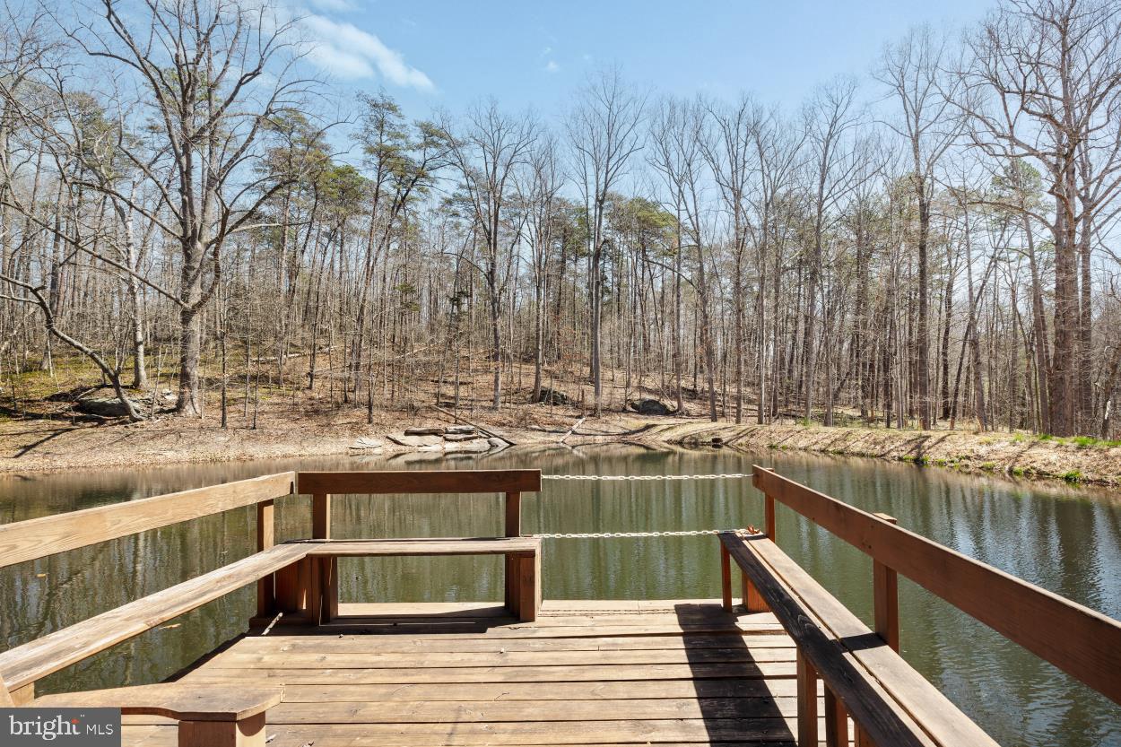 5930 Wilson Road Marshall, VA 20115 - Photo 36 of 46 a view of a swimming pool with a deck and trees