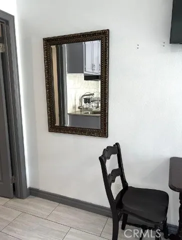 a view of a chair and table in a bedroom